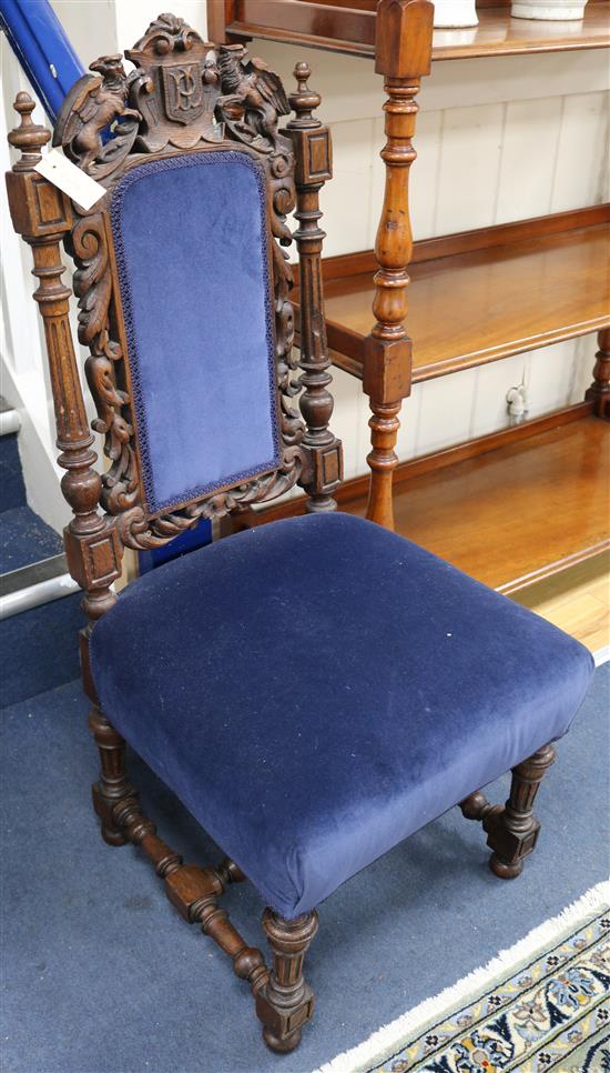 An Edwardian carved oak hall chair